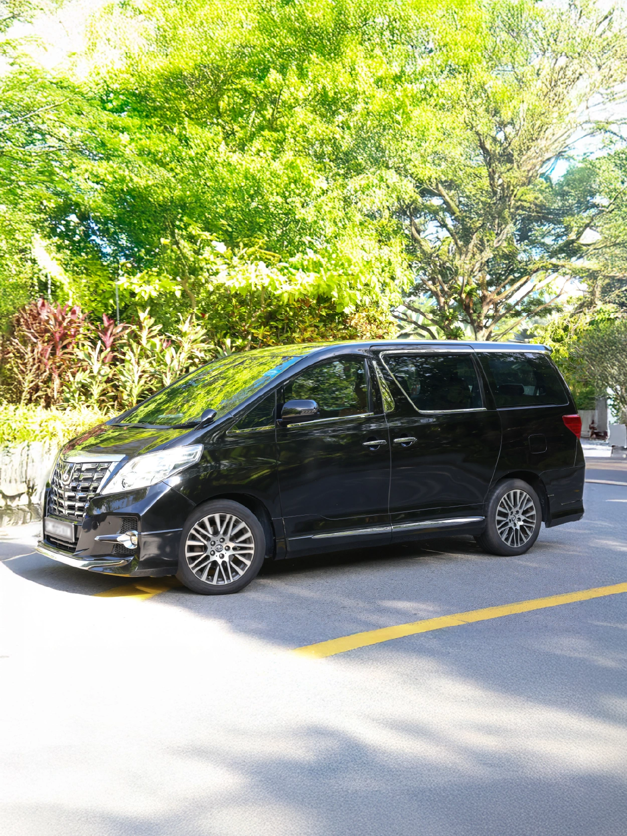 Black luxury van on city road