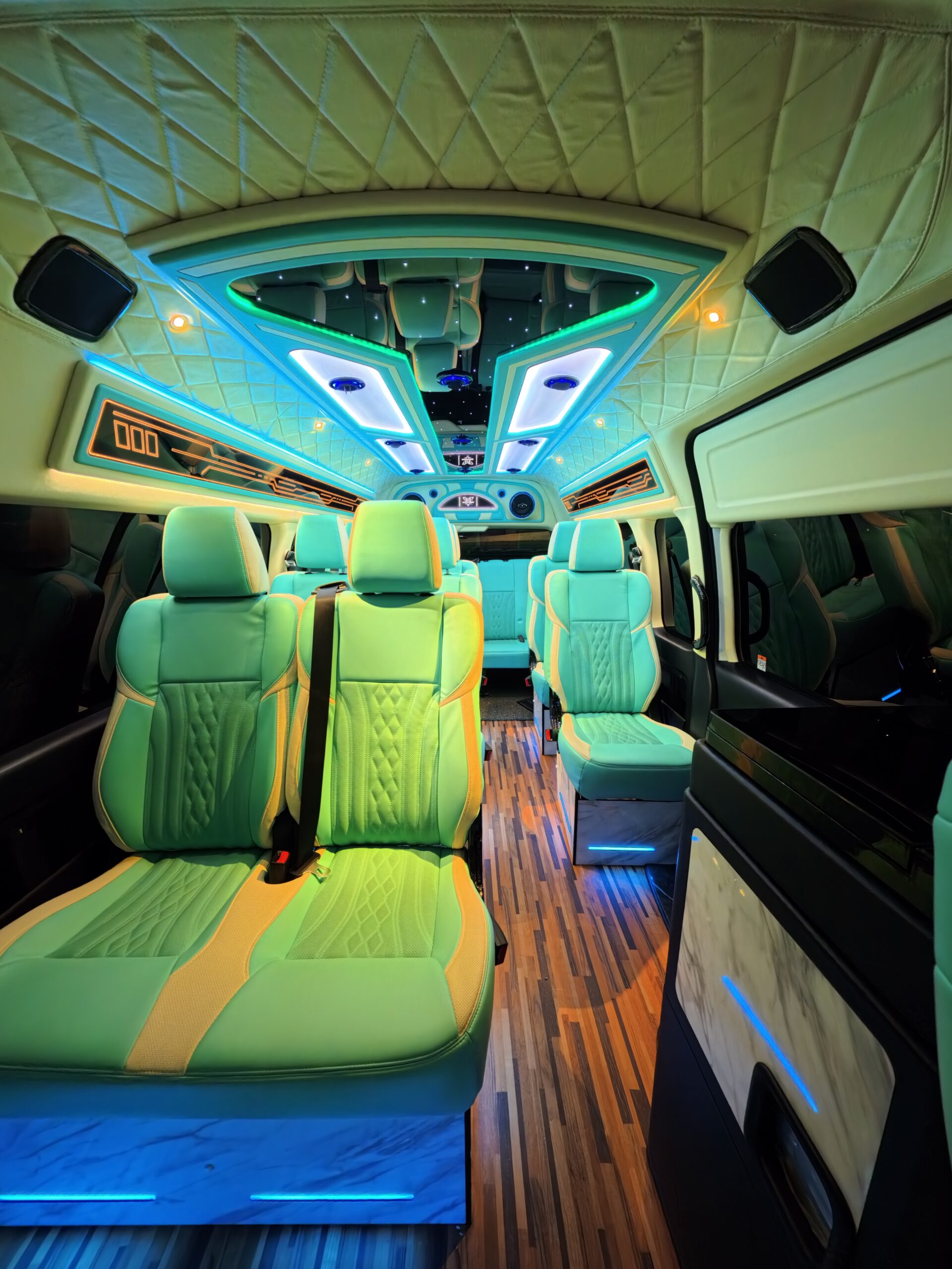 Luxury van interior with ambient lighting and premium seating for comfortable private transport services